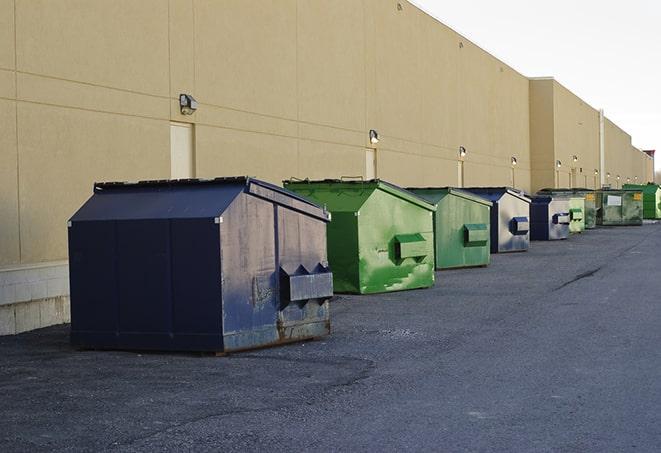 a fleet of red and blue construction dumpsters available for use in Evanston